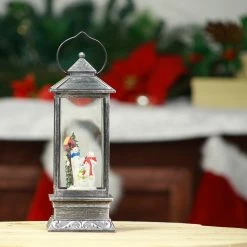 Best deal ⭐ Alpine Corporation 11"H Indoor Lantern Snowman Snow Globe Holiday Decoration With LED Light, Bronze Black 🎁 -Alpine Corporation Sales Alpine Corporation Lantern Snow Globe with Warm White LED Light 13